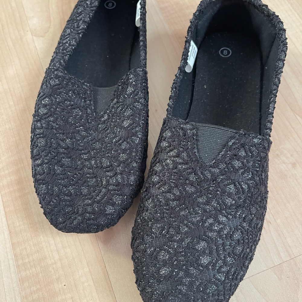 Ladies black slip ons with sparkle in the cloth
